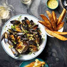 bowl of mussels and fries